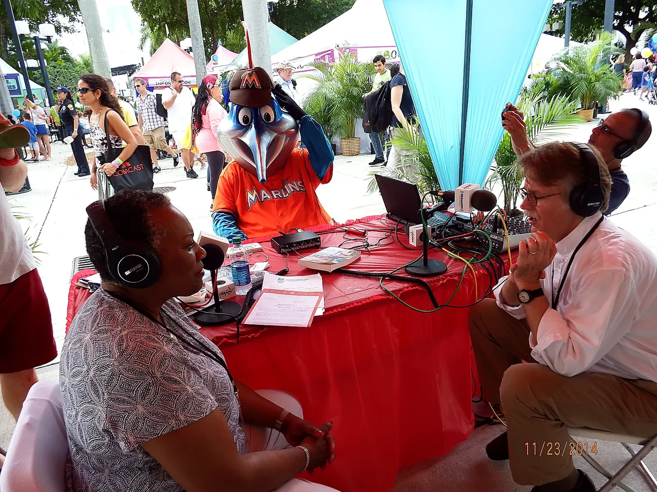 Maggie Linton conducting an outdoor SiriusXM interview at the Miami Book Fair