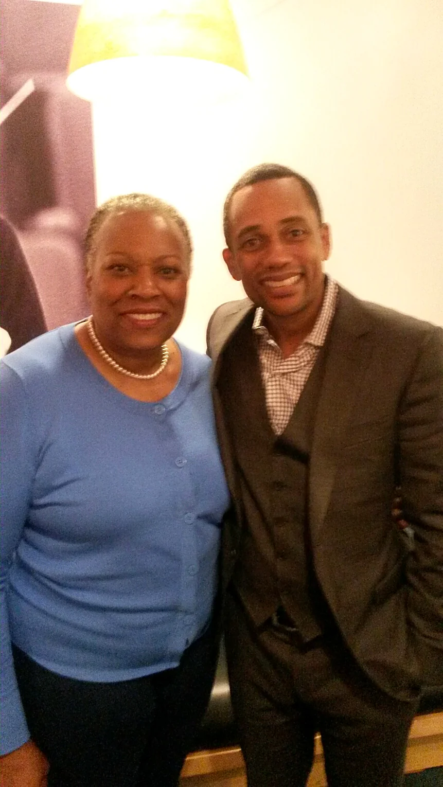 Maggie Linton with actor and author Hill Harper